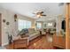 Relaxing living room with ceiling fan and hardwood floors at 4206 W Palmira Ave, Tampa, FL 33629