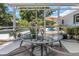 Screened-in porch featuring backyard views, pool, and patio seating, all creating a serene and inviting outdoor area at 4206 W Palmira Ave, Tampa, FL 33629