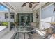 Screened-in porch with a table and chairs, view of the backyard, and perfect for relaxed outdoor dining at 4206 W Palmira Ave, Tampa, FL 33629