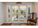 Sunroom with french doors leading to a screened-in porch and offering natural light and an inviting chair at 4206 W Palmira Ave, Tampa, FL 33629