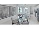 Bright eat-in kitchen with white cabinets, quartz counters and stainless steel appliances, next to dining area at 4547 Gardner St, Bradenton, FL 34210