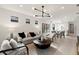 Cozy living room with contemporary furniture, decorative lighting, and an open layout to the dining area at 4547 Gardner St, Bradenton, FL 34210