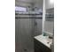 Tidy bathroom featuring a shower with clear curtain, updated vanity, and neutral finishes at 4851 W Gandy Blvd # B2L10, Tampa, FL 33611