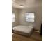 Simple bedroom with a comfortable mattress, wood flooring, and lots of sunlight at 4851 W Gandy Blvd # B2L10, Tampa, FL 33611