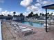 Inviting community pool with lounge chairs, tables, and clear blue water at 4851 W Gandy Blvd # B2L10, Tampa, FL 33611