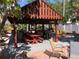 Outdoor pavilion with tables, chairs, and a grill, ideal for community socializing at 4851 W Gandy Blvd # B2L10, Tampa, FL 33611