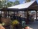 Well-equipped outdoor pavilion with a grill, tables, and views of the waterway at 4851 W Gandy Blvd # B2L10, Tampa, FL 33611