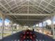 Large covered pavilion with picnic tables offers outdoor gathering space by the water at 4851 W Gandy Blvd # B2L10, Tampa, FL 33611