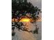 Gorgeous sunset view over the water, framed by lush green foliage, creates a serene and picturesque scene at 4851 W Gandy Blvd # B2L10, Tampa, FL 33611