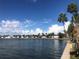Scenic water view showcases charming homes along the shoreline under a bright, cloudy sky at 4851 W Gandy Blvd # B2L10, Tampa, FL 33611