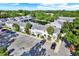 Bird's eye view showcases the community's pond, parking, and overall layout in a peaceful setting at 500 New York Ave # 22, Dunedin, FL 34698