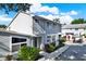 Charming townhome featuring well-maintained landscaping and a paved walkway leading to the front entrance at 500 New York Ave # 22, Dunedin, FL 34698