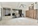 Spacious living room ready for renovation, featuring a ceiling fan, sliding glass doors and insulation at 500 New York Ave # 22, Dunedin, FL 34698