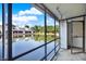 Screened-in lanai with relaxing water view, perfect for enjoying the outdoors in comfort at 500 New York Ave # 22, Dunedin, FL 34698