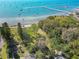 Expansive view from above Gulfport coastline, featuring the pier, a sandy beach, and the beautiful water at 5240 31St S Ave, Gulfport, FL 33707