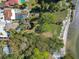 Wonderful aerial view showcasing property's private pond and access to the serene beach in Gulfport, Florida at 5240 31St S Ave, Gulfport, FL 33707