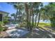 Lush backyard with paver patio, beautiful landscaping and serene water views, creating a private oasis at 5240 31St S Ave, Gulfport, FL 33707