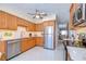 Kitchen boasts modern appliances, light wood cabinets, and seamless access to the adjacent living room at 5240 31St S Ave, Gulfport, FL 33707