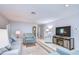 Cozy living room featuring neutral paint, plush seating, and a modern entertainment center at 5240 31St S Ave, Gulfport, FL 33707
