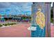 Street view of Owaddy's restaurant with a fountain and a statue in the foreground at 5240 31St S Ave, Gulfport, FL 33707
