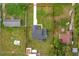 An aerial view of the property featuring a house with a well-maintained lawn and a long driveway at 5303 Glen Harwell Rd, Plant City, FL 33566