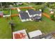 Aerial view of home shows the backyard, shed and surrounding fence at 5303 Glen Harwell Rd, Plant City, FL 33566