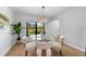 Bright dining room features a chandelier and view of the outdoors at 5303 Glen Harwell Rd, Plant City, FL 33566