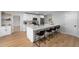 Modern kitchen featuring a large center island with seating and stainless steel appliances at 5303 Glen Harwell Rd, Plant City, FL 33566