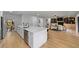 Open-concept kitchen with a large island, modern appliances, and seamless flow into the living space at 5303 Glen Harwell Rd, Plant City, FL 33566