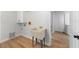 Bright laundry room features a wash basin, white cabinets and wood-look flooring for easy cleaning at 5303 Glen Harwell Rd, Plant City, FL 33566