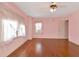 Sunny bedroom features hardwood floors and a ceiling fan at 535 22Nd N Ave, St Petersburg, FL 33704