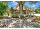 Brick home featuring mature landscaping, a walkway, and off street parking at 535 22Nd N Ave, St Petersburg, FL 33704