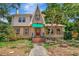 Charming, two-story home showcasing unique architectural details and a well-maintained front yard at 535 22Nd N Ave, St Petersburg, FL 33704