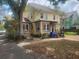 Attractive home with brick accents and a welcoming front porch, surrounded by mature trees at 535 22Nd N Ave, St Petersburg, FL 33704