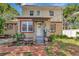 Charming brick home featuring a quaint front entrance, brick walkway, and garden space at 535 22Nd N Ave, St Petersburg, FL 33704