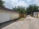 View of a detached garage with a white door, offering additional parking and storage space at 535 22Nd N Ave, St Petersburg, FL 33704