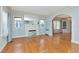 Bright living room with hardwood floors, a decorative fireplace, and arched doorways at 535 22Nd N Ave, St Petersburg, FL 33704