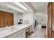 Bathroom features a spacious vanity, mirror, and adjacent bedroom, creating a serene and convenient layout at 5633 99Th N Ter, Pinellas Park, FL 33782