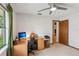 Bedroom featuring a ceiling fan, desk and a window, offering a bright and comfortable work-from-home space at 5633 99Th N Ter, Pinellas Park, FL 33782