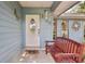 Inviting front entrance featuring a decorative glass door and cozy bench seating at 5633 99Th N Ter, Pinellas Park, FL 33782