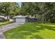 Beautiful home with lush green lawn and mature trees providing ample shade at 5633 99Th N Ter, Pinellas Park, FL 33782