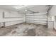 Spacious garage features ample storage with wall-mounted cabinets and overhead door with opener at 5633 99Th N Ter, Pinellas Park, FL 33782