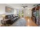 Bright living room featuring hardwood floors and a cozy seating area at 5633 99Th N Ter, Pinellas Park, FL 33782