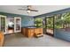 The enclosed patio showcases a relaxing hot tub with an outdoor view through a large screened opening at 5633 99Th N Ter, Pinellas Park, FL 33782