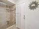 The walk-in shower offers custom tiling and a built-in bench at 5633 99Th N Ter, Pinellas Park, FL 33782