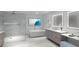 Modern bathroom with a glass shower, soaking tub, and dual illuminated mirrors at 5701 Bowen Daniel Dr. # 806, Tampa, FL 33616