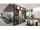 Elegant common area with a bookshelf room divider and inviting seating arrangements at 5701 Bowen Daniel Dr. # 806, Tampa, FL 33616