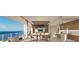 Spacious dining room with balcony access that offers stunning water views and an adjacent open-concept kitchen at 5701 Bowen Daniel Dr. # 806, Tampa, FL 33616