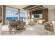 Bright living room with expansive windows, comfortable seating, and a scenic ocean view at 5701 Bowen Daniel Dr. # 806, Tampa, FL 33616