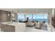 Spacious living room with ocean views, modern furniture, and an open floor plan at 5701 Bowen Daniel Dr. # 806, Tampa, FL 33616